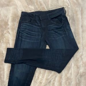 Buckle black skinny jeans